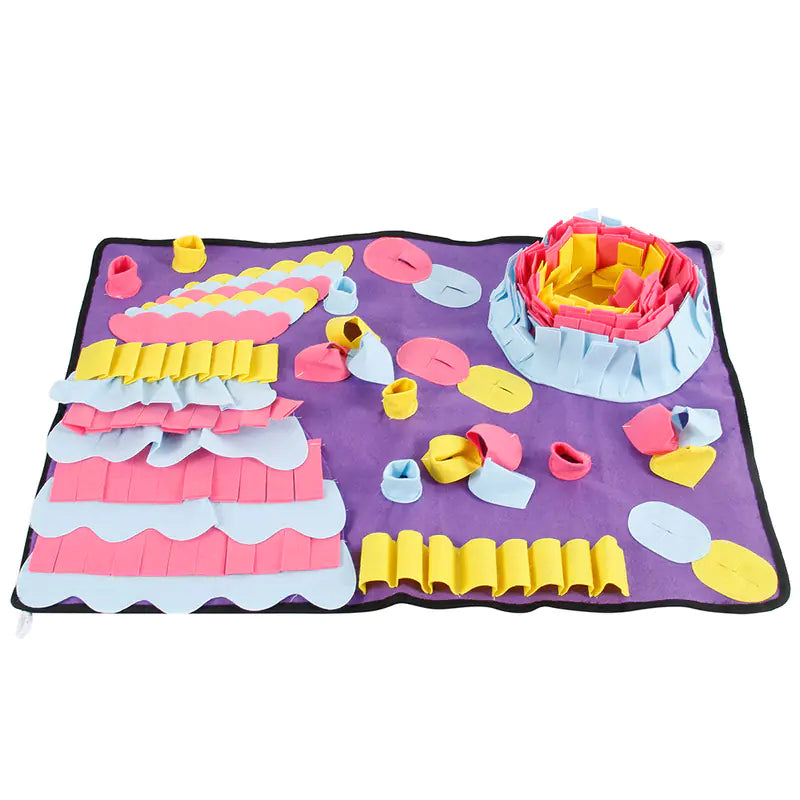Dog using SniffMat snuffle mat to find hidden treats
